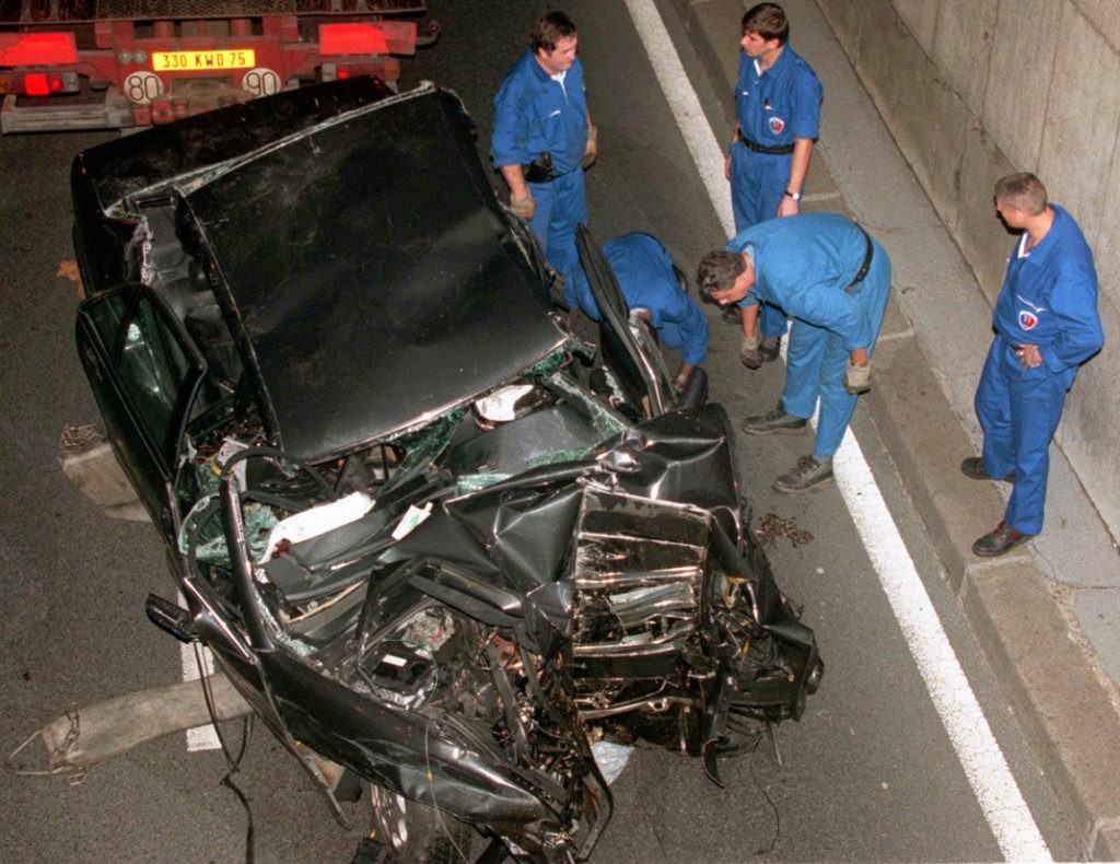 ** FILE ** Police services prepare to take away the damaged car in the Pont d'Alma tunnel in Paris in which Diana, Princess of Wales, was traveling in this Aug. 31, 1997 file photo.