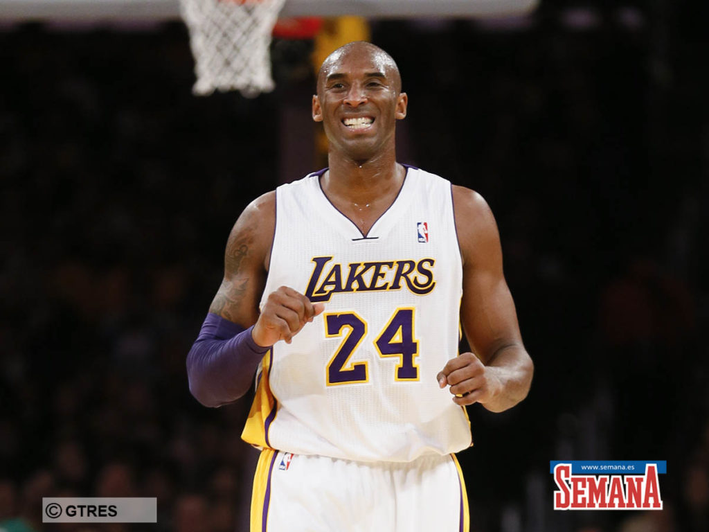 Los Angeles Lakers' Kobe Bryant winces against the Toronto Raptors during the first half of an NBA basketball game in Los Angeles, Sunday, Dec. 8, 2013.
