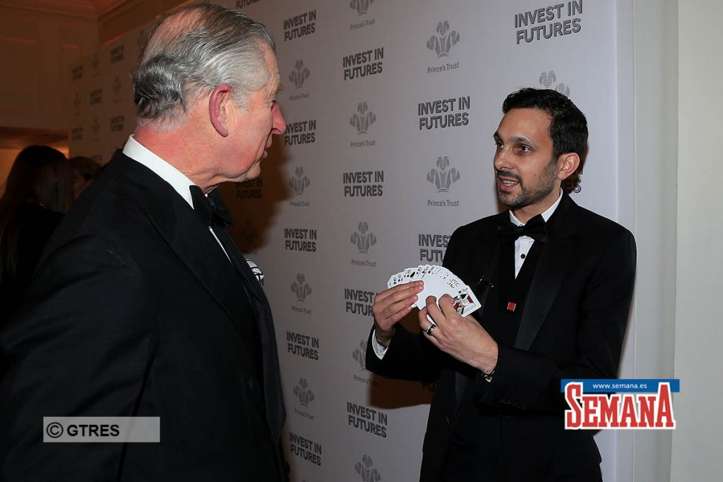 The Prince of Wales takes part in a card trick with magician Dynamo attending the annual PrinceÕs Trust 'Invest In Futures' reception  in London.