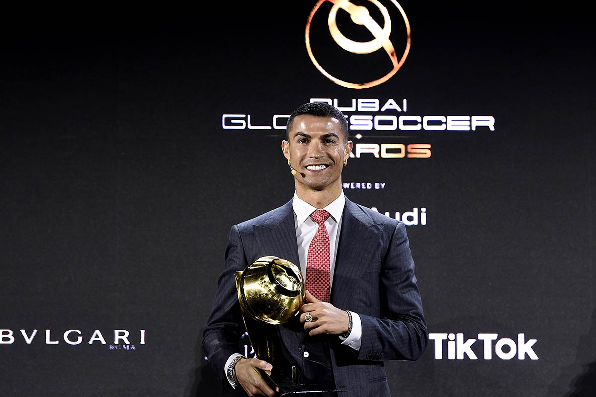 Soccer Football - Globe Soccer Awards - Armani hotel, Burj Khalifa, Dubai, United Arab Emirates - December 27, 2020 Juventus' Cristiano Ronaldo poses with a trophy after winning the Player of the Century award