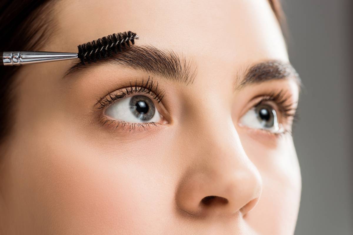cropped-view-of-young-woman-styling-eyebrow-with-e-72V6MWU