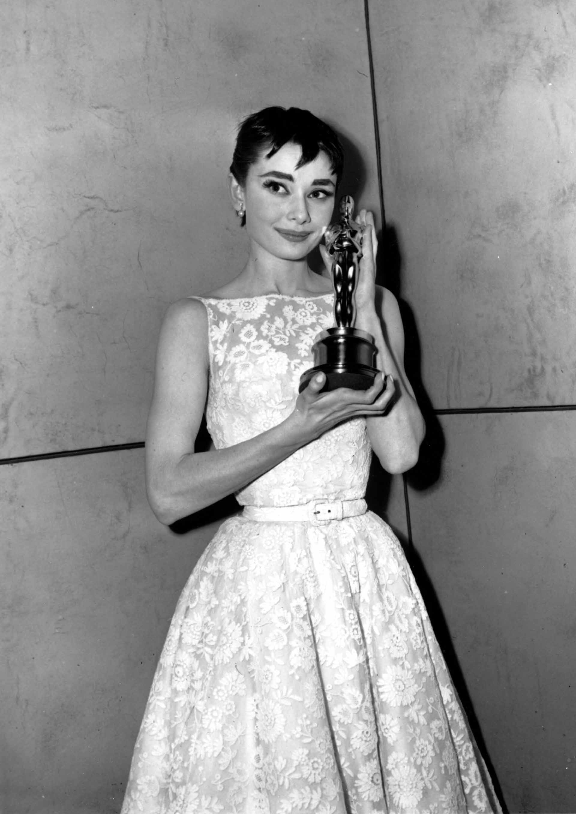 Audrey Hepburn poses with her statuette at the 26th Annual Academy Awards ceremony in New York on March 25, 1954.  Hepburn won for best actress for her portrayal in "Roman Holiday."
