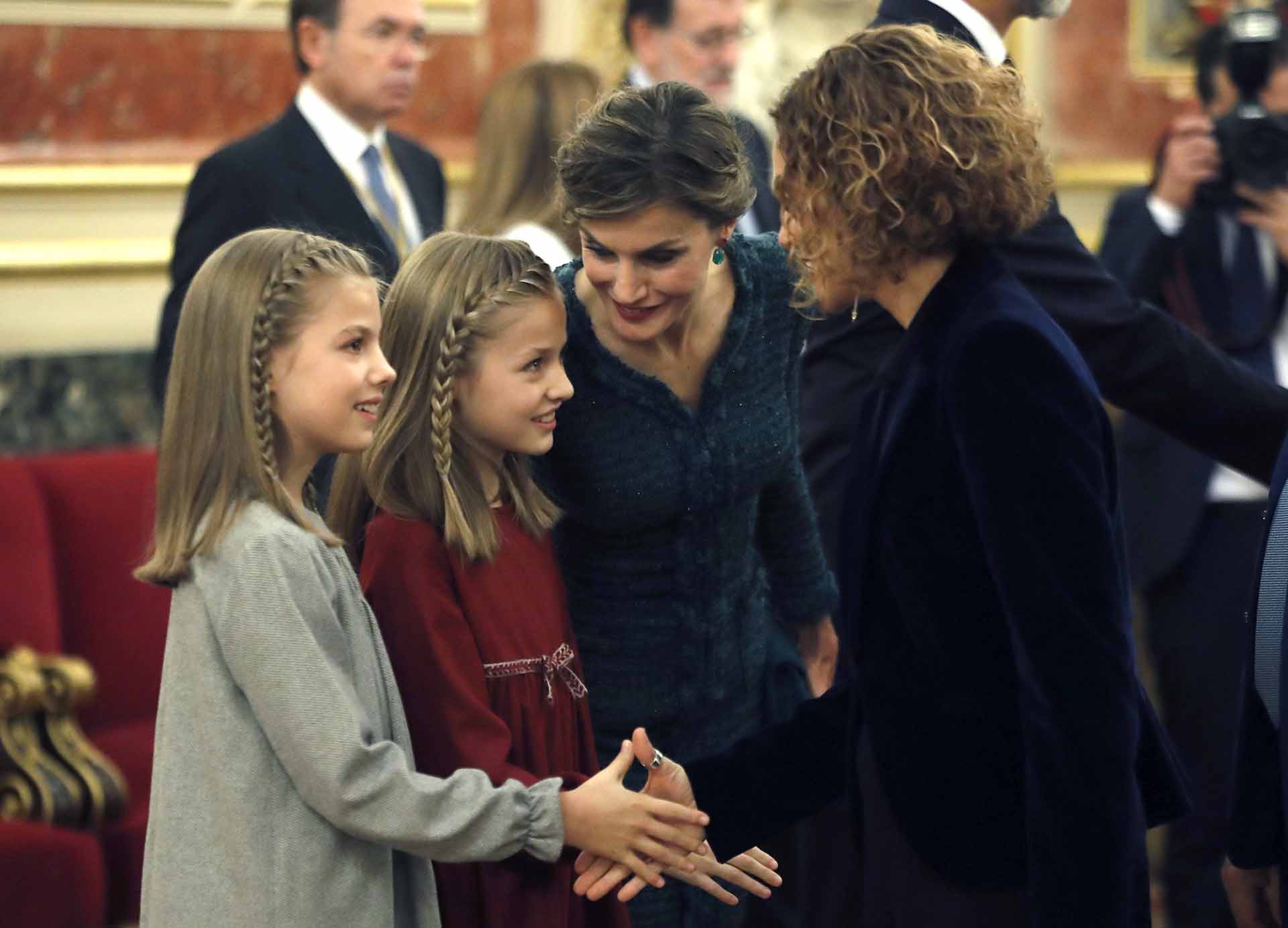 Infanta Sofía (i) and Princess Leonor (2i) greet the Socialist deputy Meritxell Batet during ceremony of Opening of the Cortes in the XII Legislature in the Congress of the Deputies , Madrid
