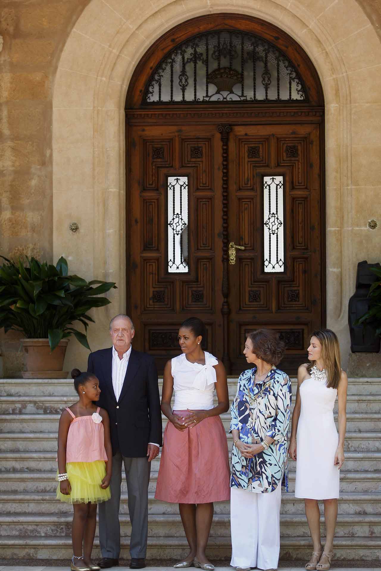 From left: Sasha Obama, Spain's King Juan Carlos, U.S. first lady Michelle Obama, Spain's Queen Sofia and Princess Letizia pose before a lunch at the Marivent Palace, in Palma de Mallorca, Spain, Sunday, Aug. 8, 2010.