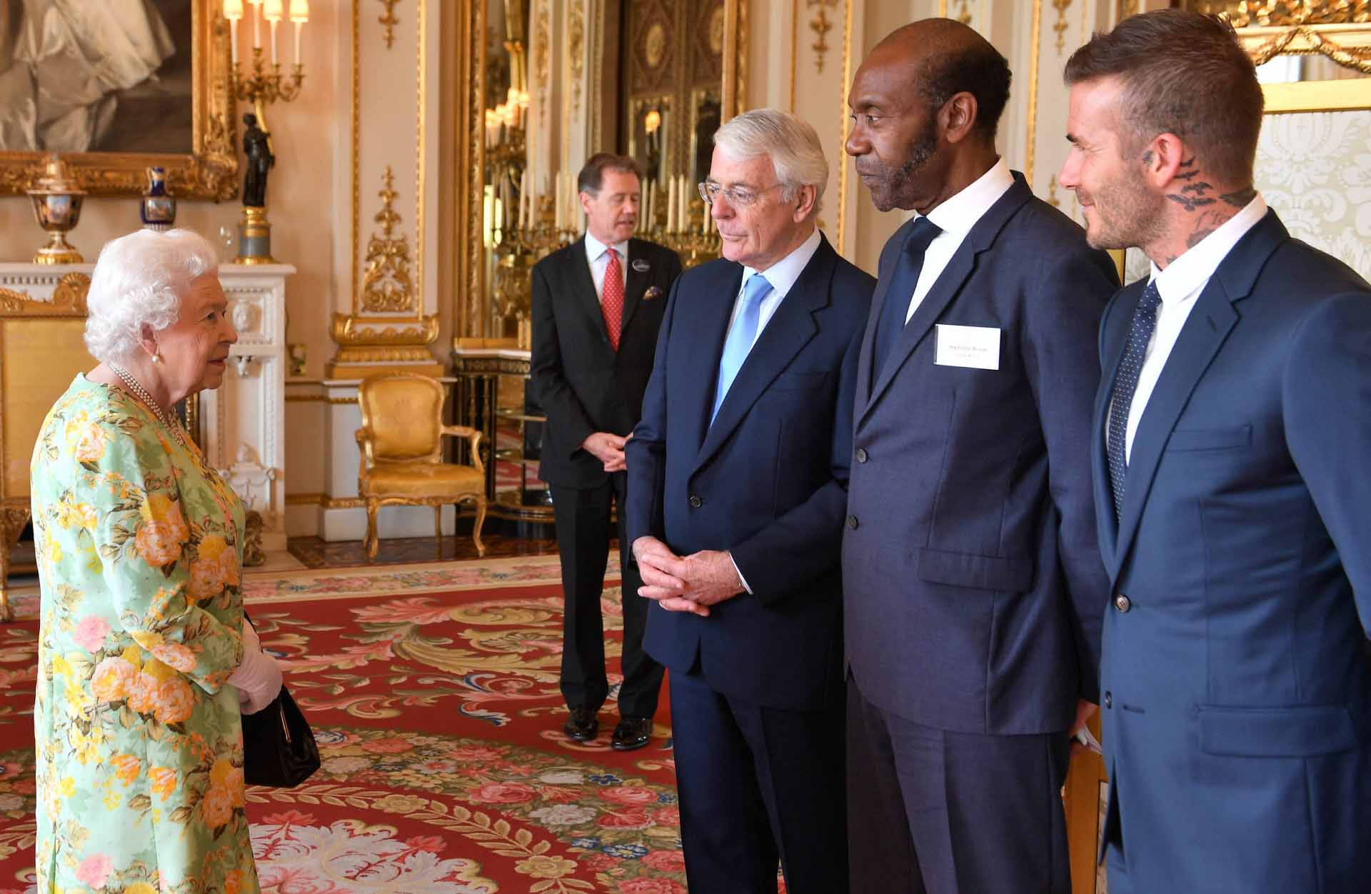 Queen Elizabeth II meets (left to right) Sir John Major, Sir Lenny Henry and David Beckham attend the Queen's Young Leaders Awards ceremony at BuckinghamPalace in London, Tuesday, June 26, 2018.  *** Local Caption *** .