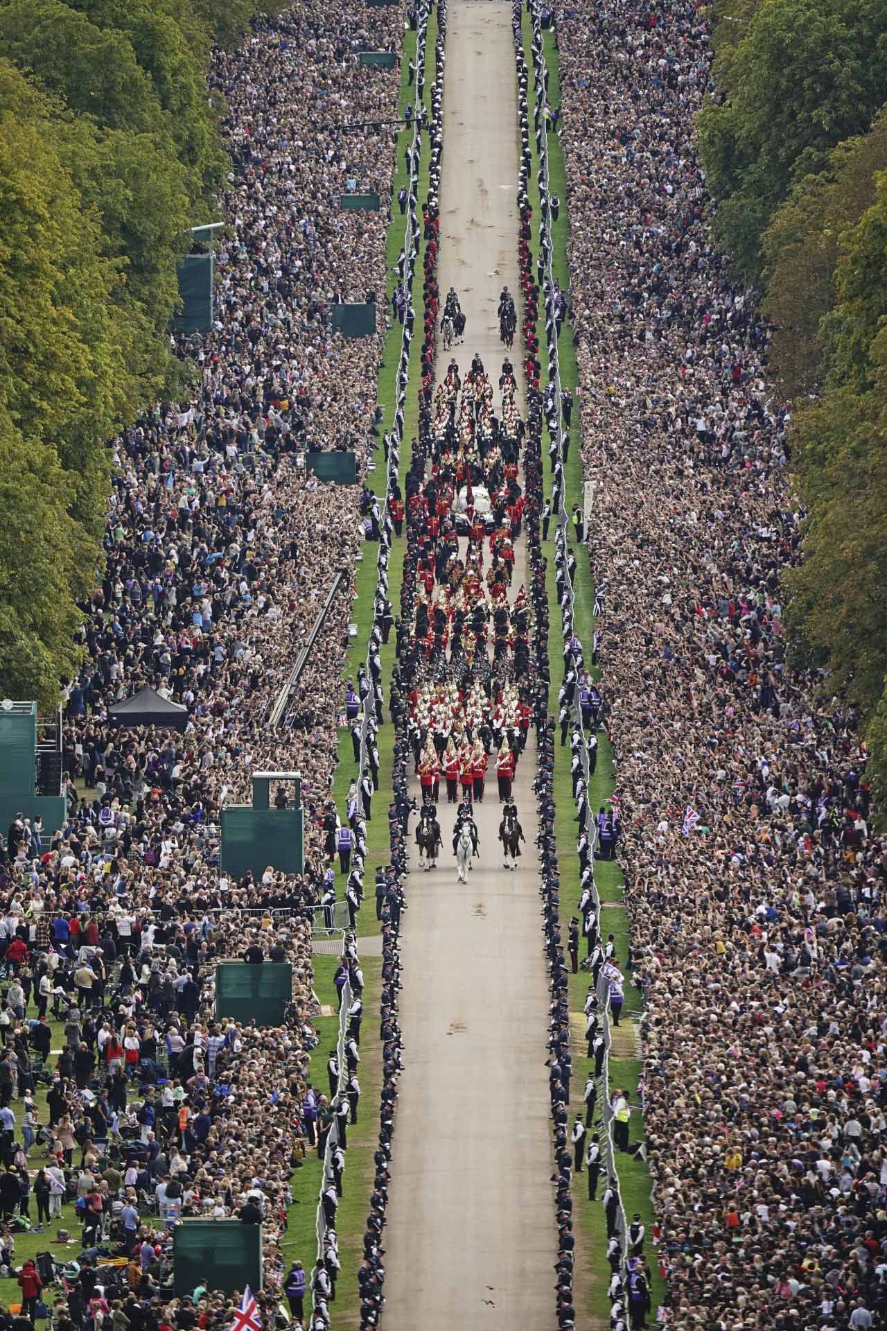 The Ceremonial Procession of the coffin of Queen Elizabeth II travels down the Long Walk as it arrives at Windsor Castle for the Committal Service at St George's Chapel, in Windsor, England, Monday, Sept. 19, 2022. (Aaron Chown/Pool photo via AP) *** Local Caption *** .