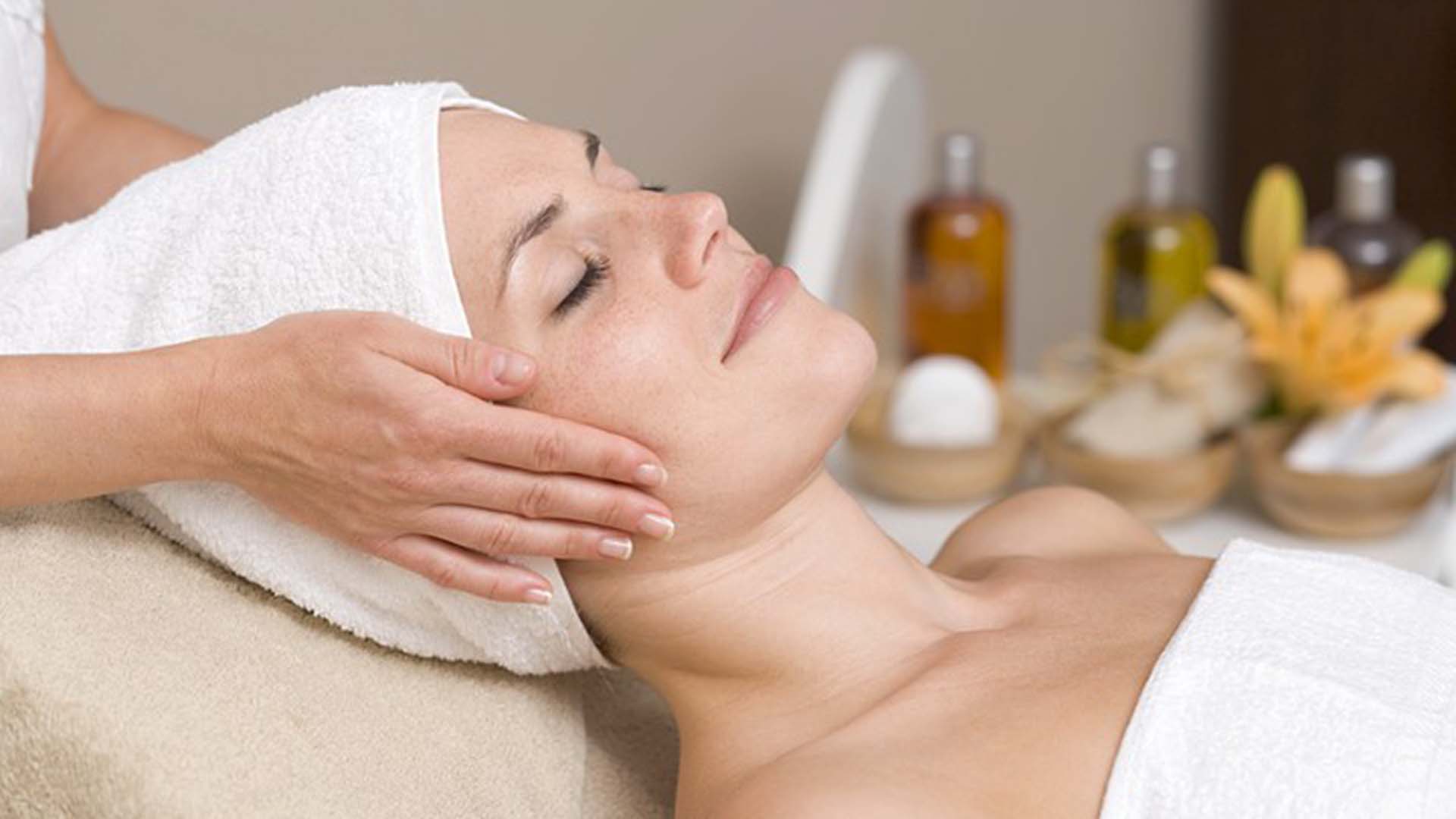 Woman having beauty treatment (face massage)