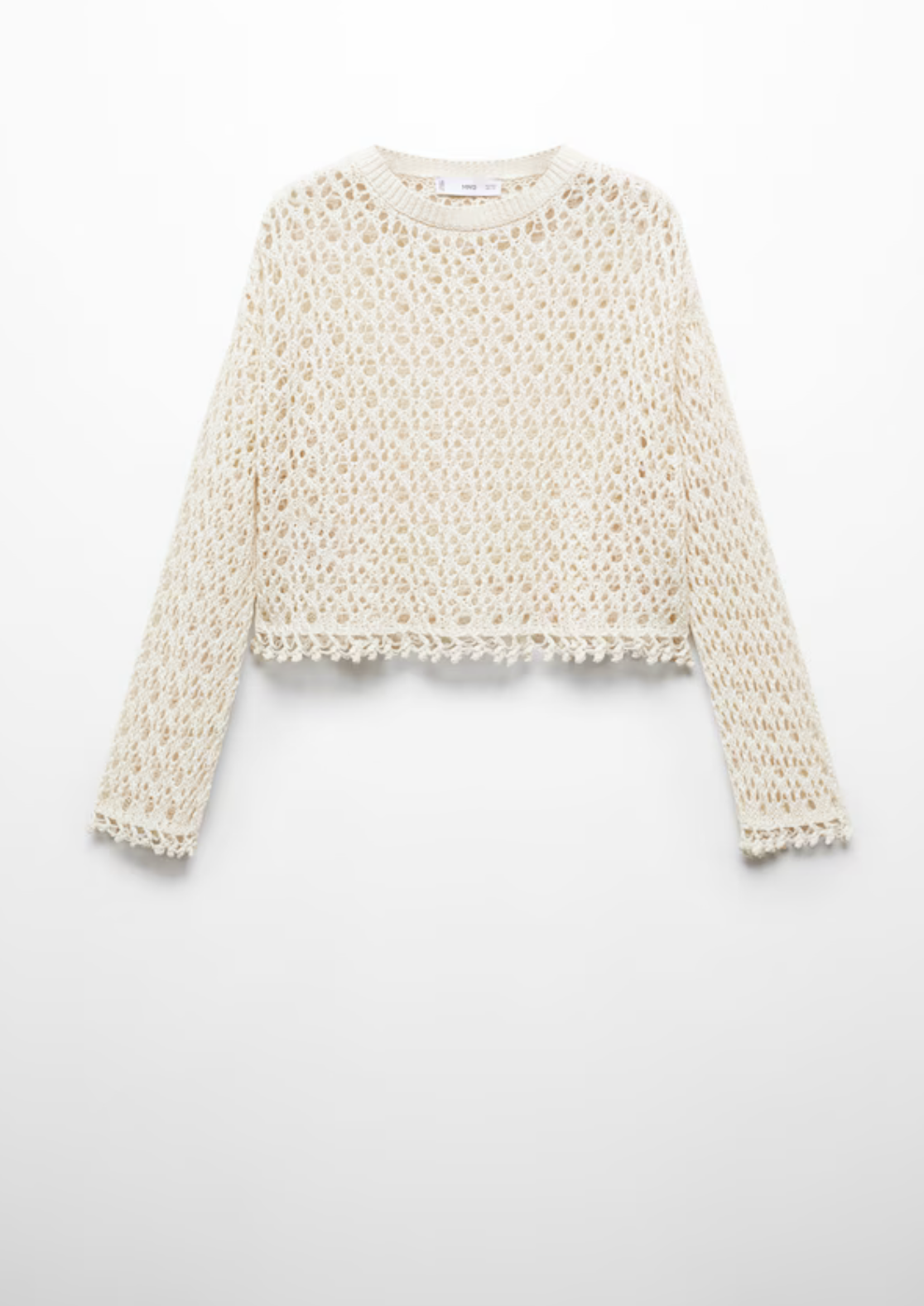 Este jersey de tejido crochet es ideal para tus próximas escapadas a la playa