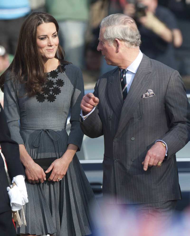 Kate Middleton y Carlos de Inglaterra durante un acto. 