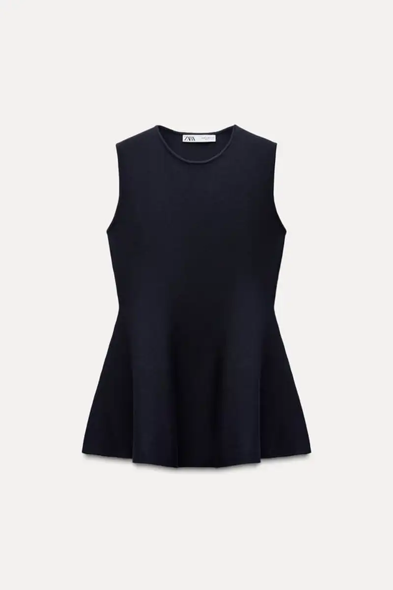 Top peplum punto de Zara 29,95 euros